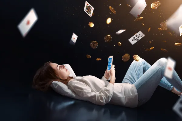 UUOK App — Enjoy seamless gaming on your smartphone A young woman relaxing with her phone while dynamic casino elements float around her, illustrating the smooth mobile experience offered by the UUOK app.